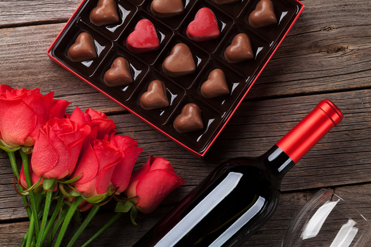 Valentines day with red roses, wine and chocolate - Central Florida Lifestyle