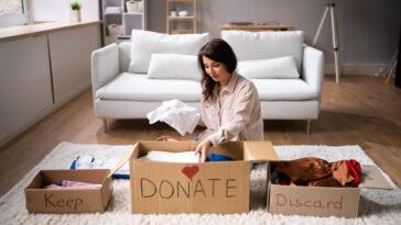 Woman Donating and practicing Decluttering tips And Cleaning Up Wardrobe Clothes