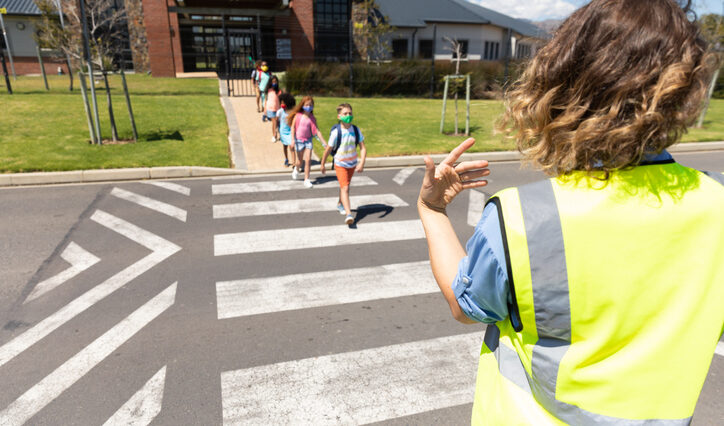 school kids crossing the street. promoting school safety.