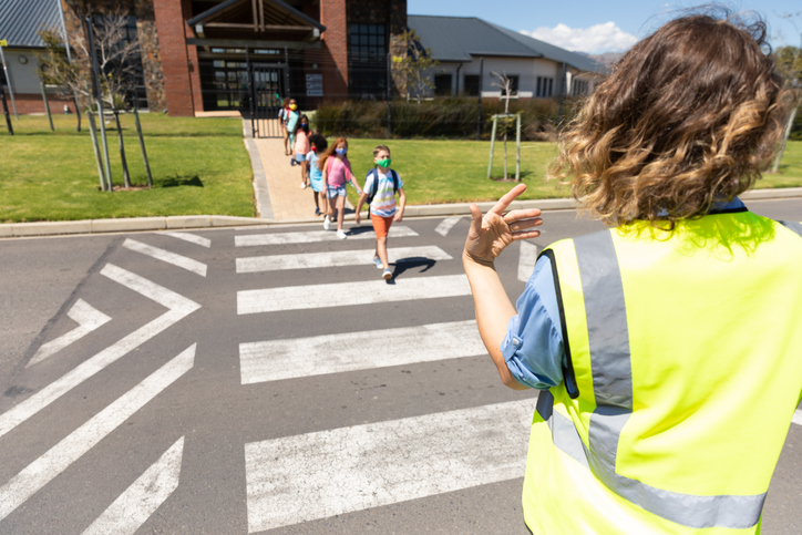 school kids crossing the street. promoting school safety.