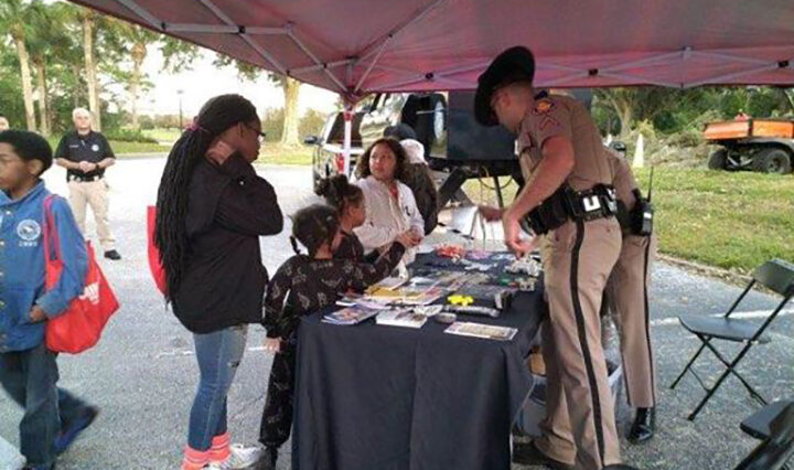 photo of community members interacting with the police at National Night Out