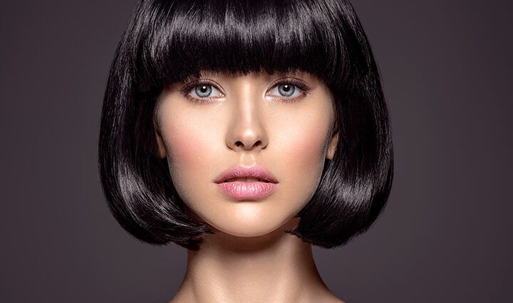Woman with beauty short black hair. winter hair trend.