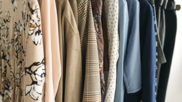 Clothes hanging on hangers.