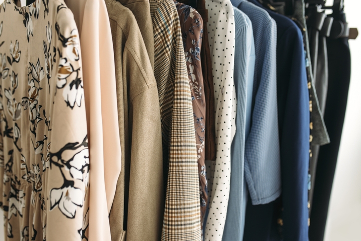 Clothes hanging on hangers.