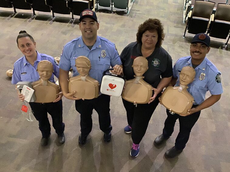 IMG_4107 - Copy - Central Florida Lifestyle paramedics stand together with cpr dummies