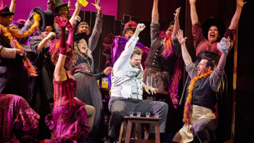 Michael Hegarty as Alfred P Doolittle center and The Company of The National Tour of MY FAIR LADY Photo by Jeremy Daniel
