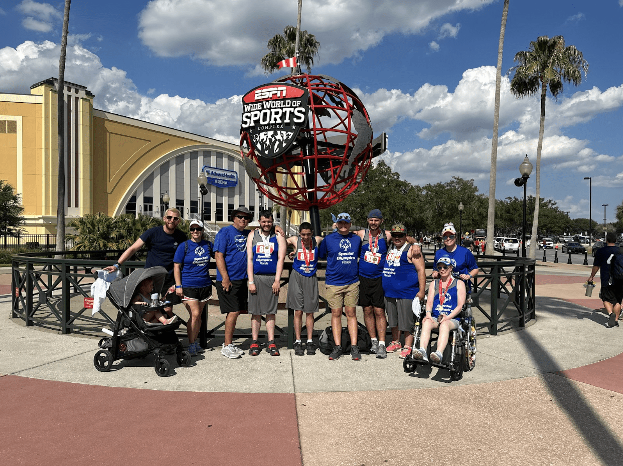 Hillsborough County Track and Field Team in front of the ESPN Wide World of Sports globe at the Special Olympics.