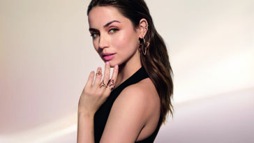 Photo of woman wearing the silhouette blossom collection jewelry.