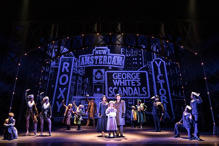 Photo of the cast of Annie.