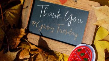A thank you card with the hashtag words Giving Tuesday #GivingTuesday to thank social media community for donations, support and philanthropy