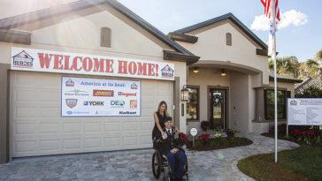 photo of a veteran at a ceremony put on by Building Homes for Heroes.