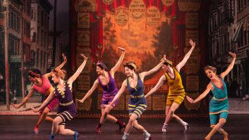 Group of performers on stage during the production of Funny Girl.