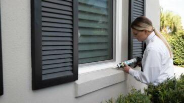 Photo of someone at Massey Services fixing up a house to prevent pests from entering.