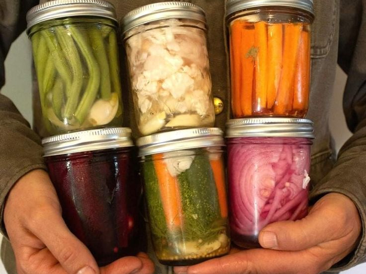 Someone holding jars