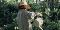 A lady watering her plants
