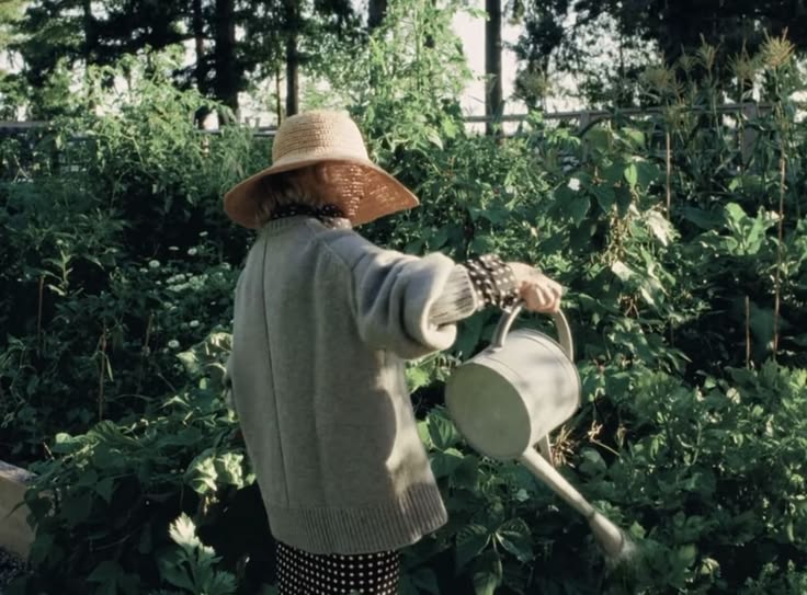 A lady watering her plants