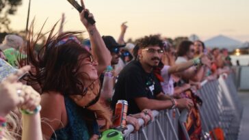 A girl dancing to music at the Florida Groves Festival.