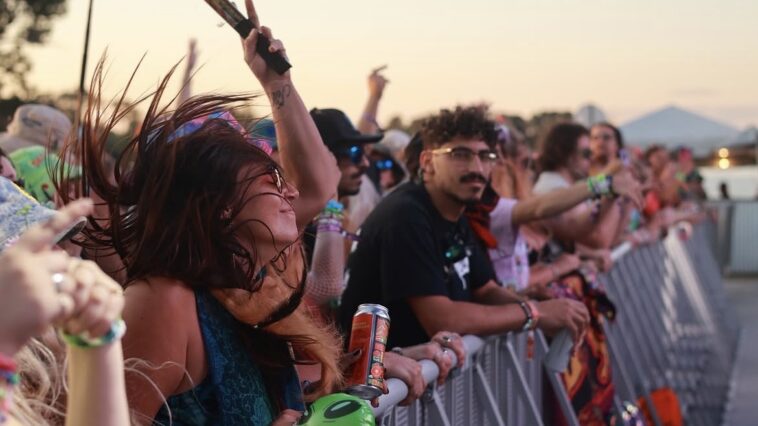 A girl dancing to music at the Florida Groves Festival.