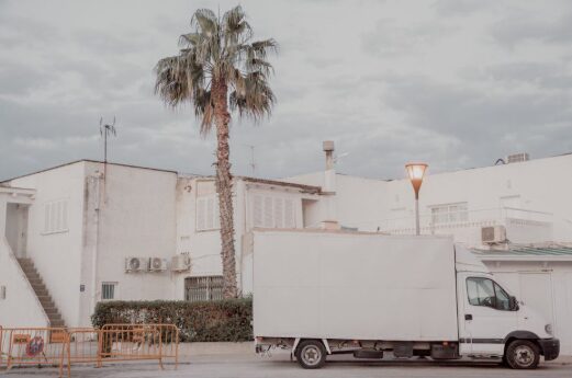 Moving truck pulling into an Orlando suburban neighborhood on a sunny day
